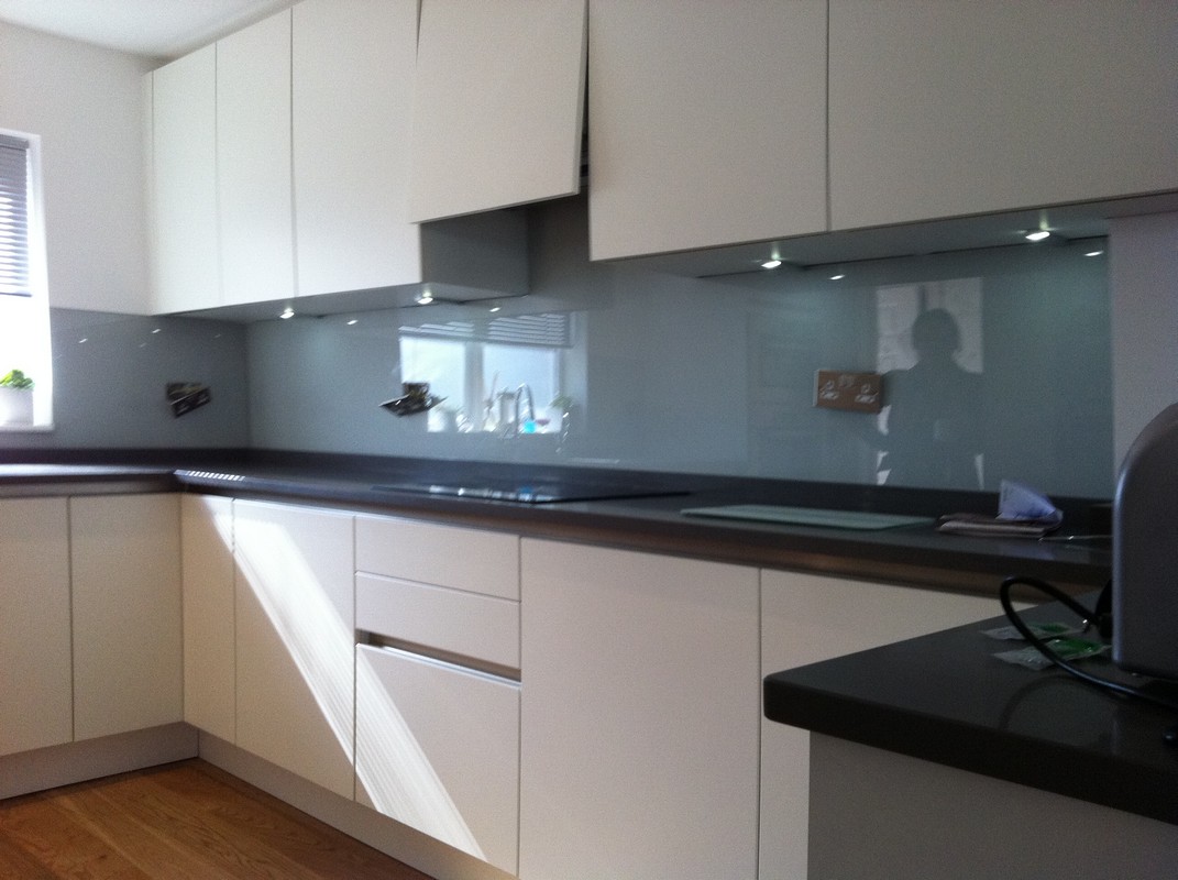 Grey glass kitchen splashback with LED lighting in Berkhamsted